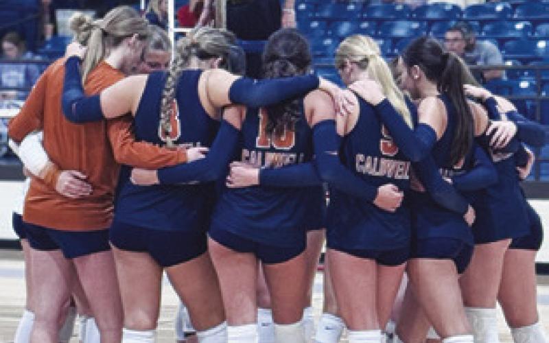 THE LADY HORNETS HUDDLE at the Leon Tournament last week.