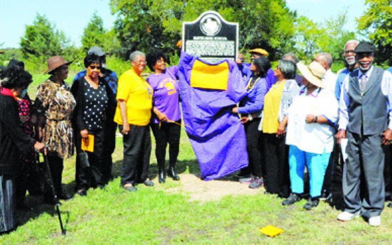 SMITH HIGH SCHOOL ALUMNI unveil the new Texas Historical Marker for Smith High School at last Saturday’s dedication ceremony. -- Tribune photo by Denise Squier