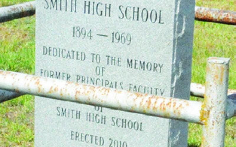 THIS STONE SITS near New Hope Missionary Baptist Church in honor of Smith High School staff and students.