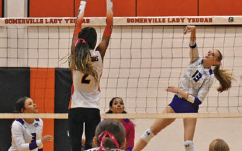 SNOOK’S DAKOTA KIENOW attempts to get the ball past Somerville’s Karys Ellis during Somerville’s win over Snook last Friday. Tribune photo by Roy Sanders