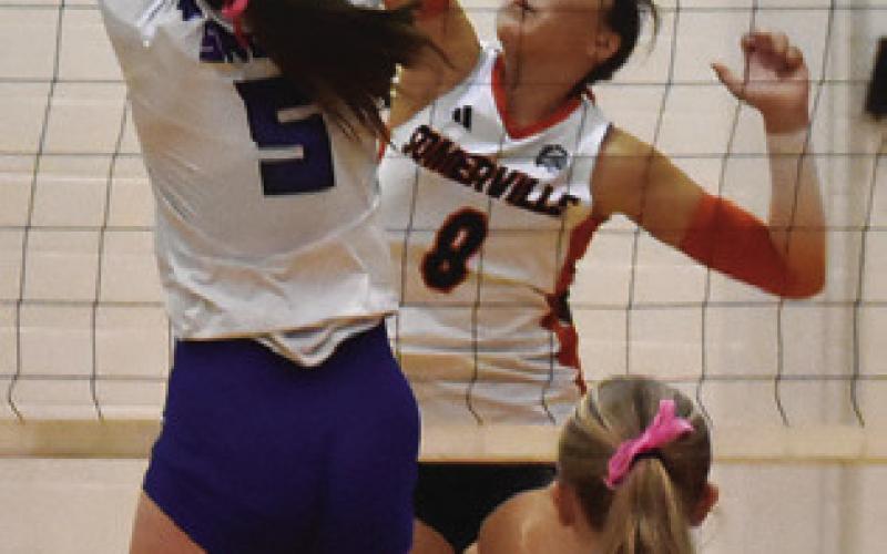 ABIGAIL RICHARDSON battles at the net with Kiley Price during the Somerville-Snook match last Friday. Tribune photo by Roy Sanders