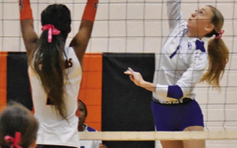 KENNEDI WITHEM reaches to attempt a kill during the Somerville-Snook match last week. Tribune photo by Roy Sanders