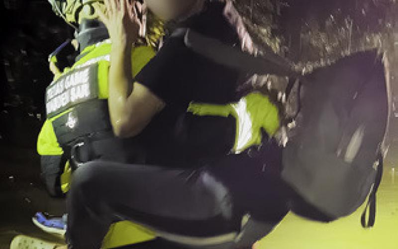 THIS MOTORIST is rescued by a Texas Parks &amp;amp; Wildlife game warden after being trapped in her car along F.M. 1362 and County Road 224. See story inside.