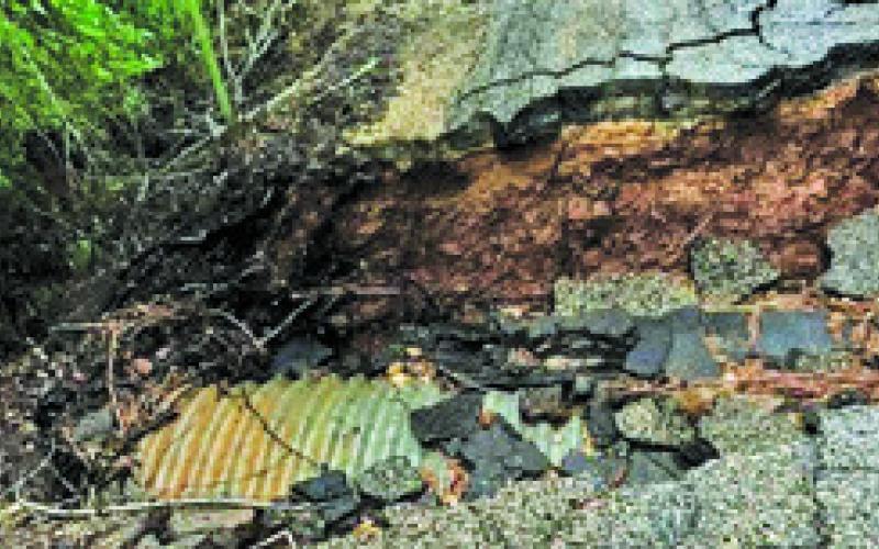 FLOOD WATERS FROM THE storm on Sunday night into Monday morning caused a portion of County Road 310 to collapse.