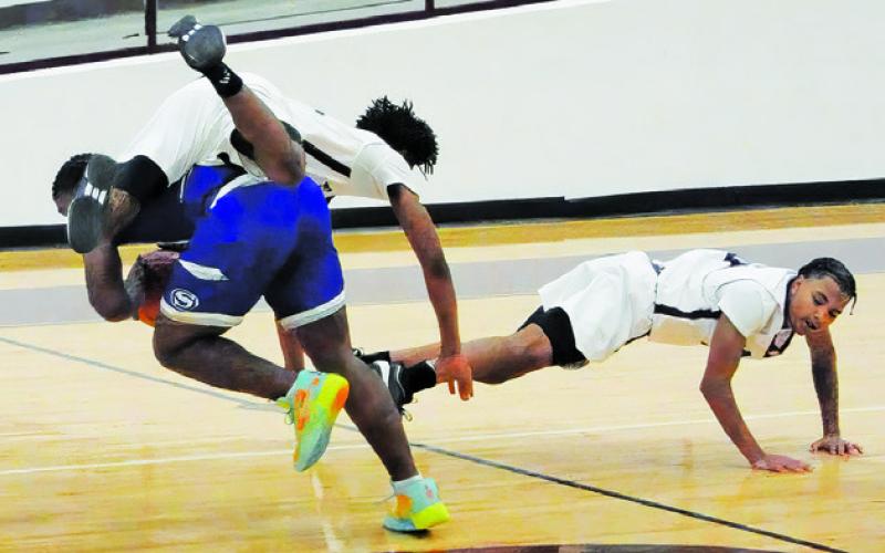 KE’TREEN CARTER OF SNOOK fights for the ball last Friday against Hearne. Tribune photo by Denise Squier