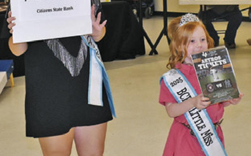 BURLESON COUNTY Fair Queen Kodi Hitchcock and Little Miss Taytum Hohlt display these items at the Go Texan auction.