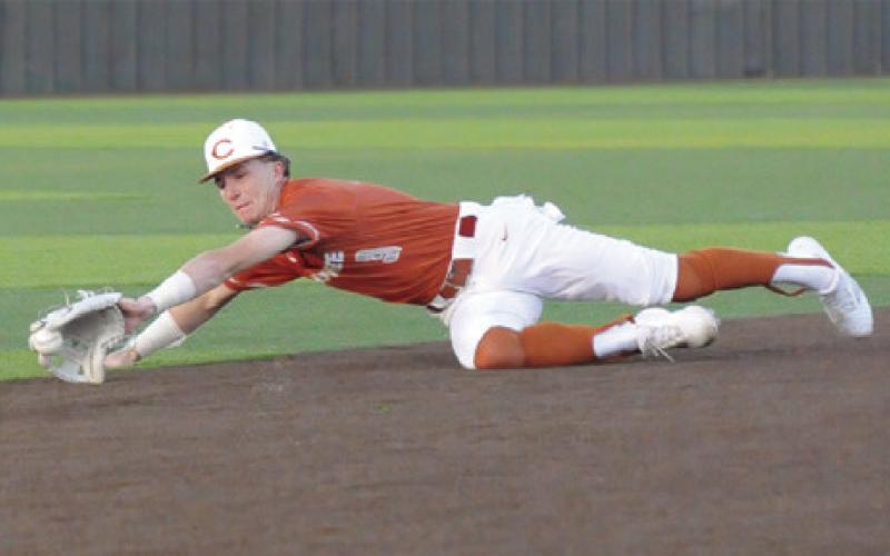RYAN SEE OF Caldwell lunges for the ball against Taylor. The Hornets won 4-3. -- Tribune photo by Denise Squier