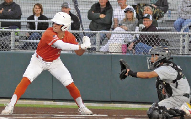 CALDWELL’S BLANE GARZA bats against Taylor. The Hornets won 4-3 in 10 innings. -- Tribune photo by Denise Squier
