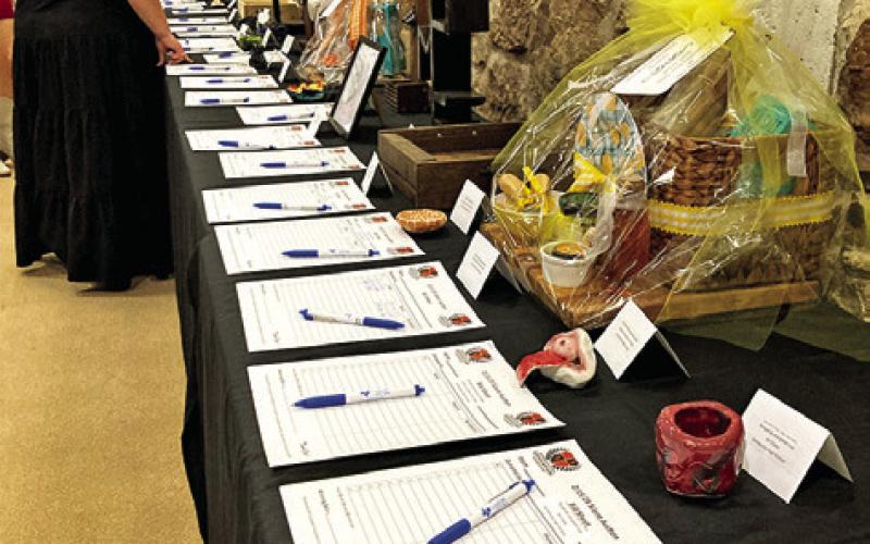 THE SILENT AUCTION PORTION of the Somerville Education Foundation’s Winter Gala featured gift baskets, artwork and more and raised over $2,500. Tribune photo by Sabine Lazo