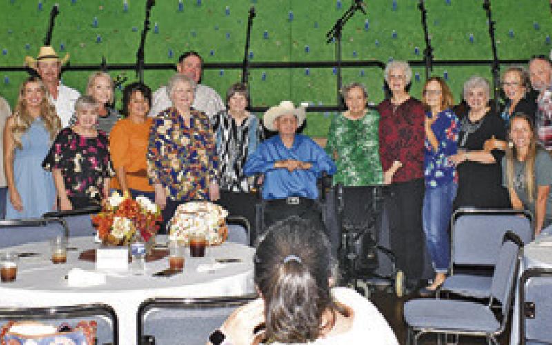 FAMILY MEMBERS GATHER TO honor Lonnie Frank, center, for his 100th birthday.