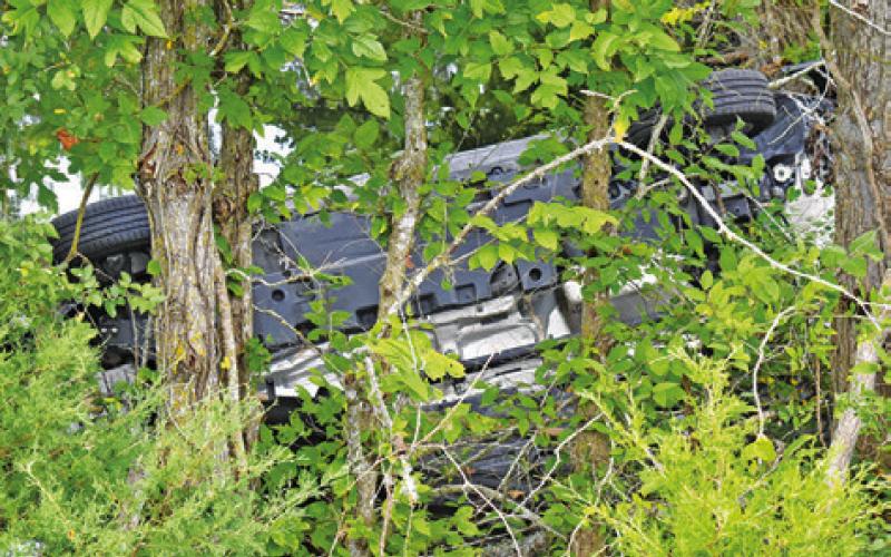 THE WRECKAGE OF the jeep is pictured at the accident scene off State Highway 36 South.