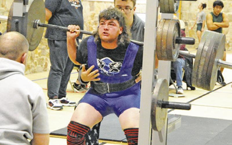 SNOOK’S MOSES STICKEL strains to lift the barbell at last Saturday’s Tri-Meet in Somerville. -- Tribune photo by Denise Squier