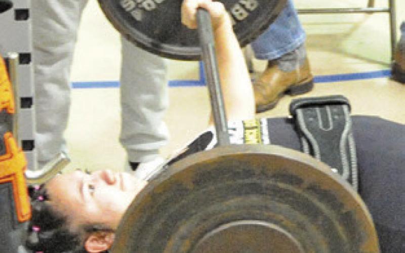 SOMERVILLE’S BRYANNA Surovik bench presses the barbell during the Tri-Meet last Saturday.