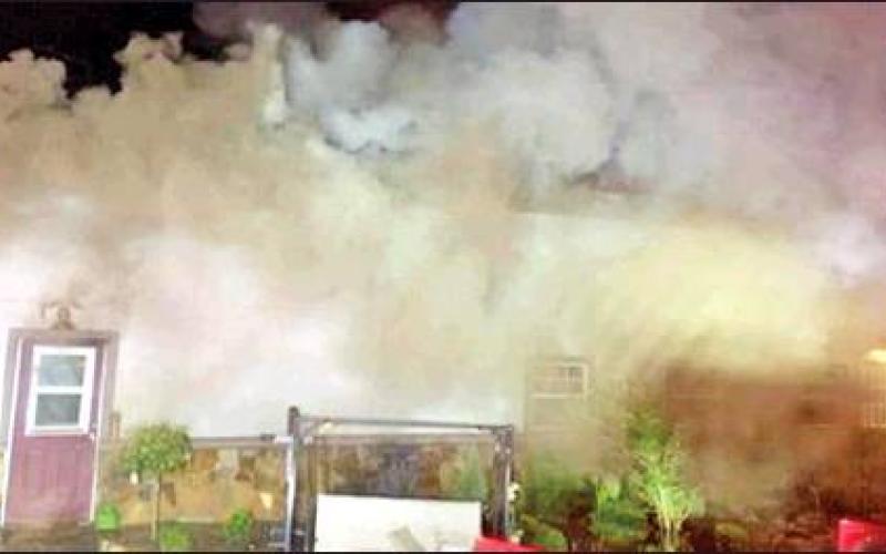 SMOKE COMES OUT OF this building early Monday at the Paradise RV Park in Snook. Snook, Beaver Creek and Somerville volunteer firefighters responded to the call and extinguished the fire.