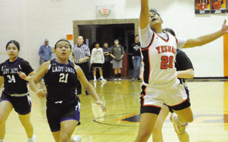SOMERVILLE’S ANNETTE REYNA leaps to try to grab a pass during the Snook-Somerville game last Tuesday night. Tribune photo by Denise Squier