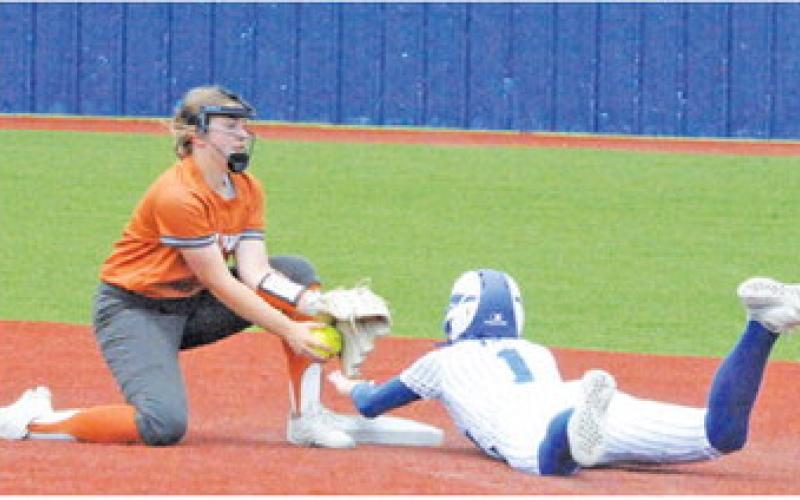 CALDWELL’S KELLY URBANOVSKY attempts to tag out a Robinson runner during the Lady Hornets’ area series at Georgetown High School.