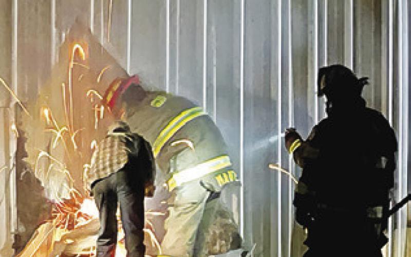 SOMERVILLE FIREFIGHTERS WORK the scene of this fire last Friday at the Dollar General store in Somerville.