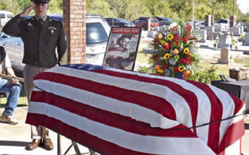 THE AMERICAN FLAG is draped over Quincy Berka’s coffin at his graveside service.
