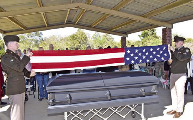 THE AMERICAN FLAG is folded by members of the U.S. Army at Quincy Berka’s graveside service in New Tabor.