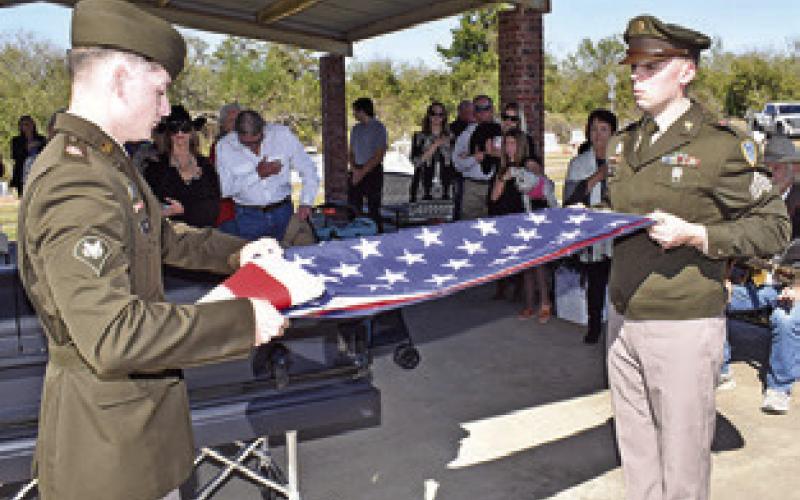 THE AMERICAN FLAG is carefully folded and as part of full military honors for Quincy Berka, the county’s last World War II veteran.
