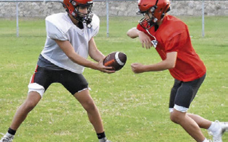 SOMERVILLE WORKS ON their offense in an early August practice session.