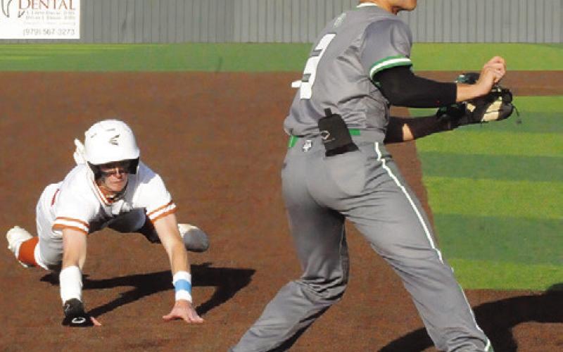 RYAN SEE OF Caldwell lunges for third base last Wednesday against Banquete. Caldwell won 10-0. -- Tribune photo by Denise Squier