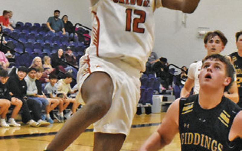 CALDWELL’S JADEN Hagan leaps high for this shot against Giddings last Friday. Tribune photo by Roy Sanders
