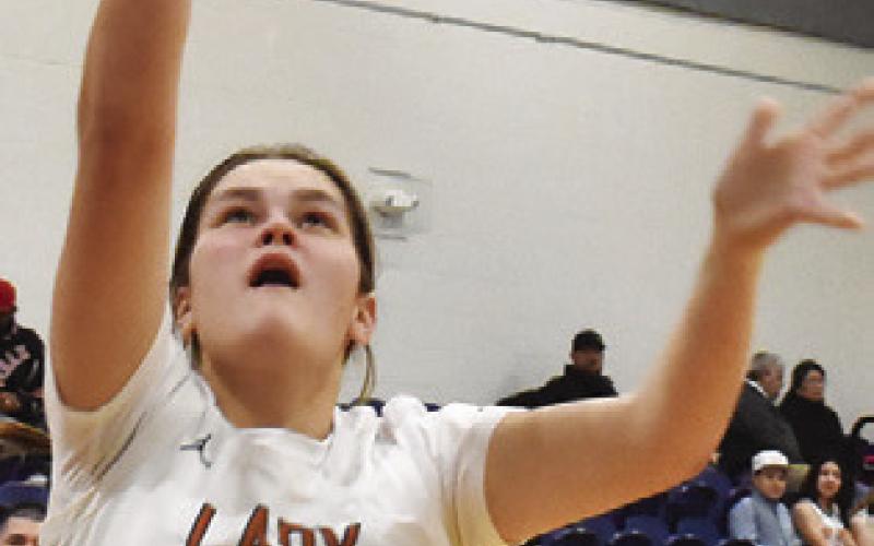 RILEY BROADDUS takes a shot during Caldwell’s 42-34 win over the Lady Buffs. Tribune photo by Roy Sanders