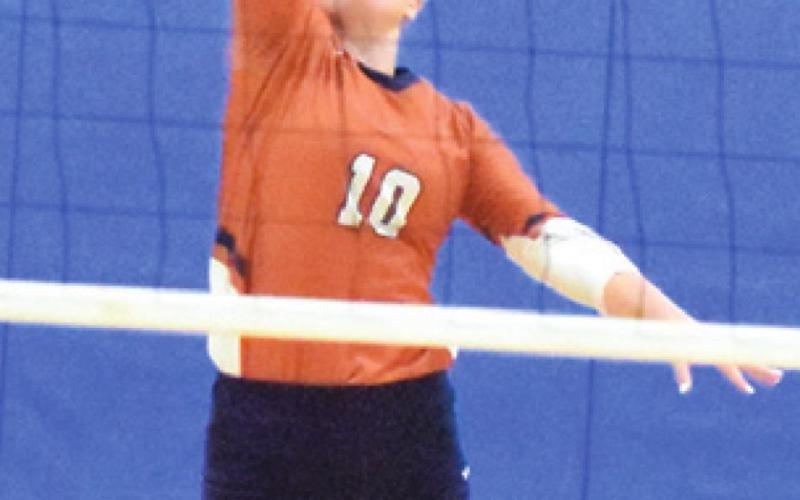 ALLIE BOWERS pushes the ball over the net during the Caldwell-Wortham match last Thursday. -- Tribune photo by Denise Squier