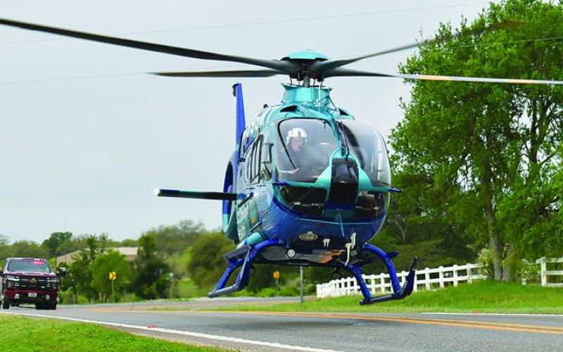 A HELICOPTER TRANSPORTS the driver in a one-vehicle accident early Monday, March 31, on F.M. 60 West near Park Road 4. No details on the accident were available at press time.