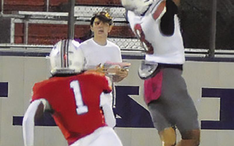 DYLAN CARTER of Caldwell makes this catch last Friday against Madisonville. Tribune photo by Denise Squier