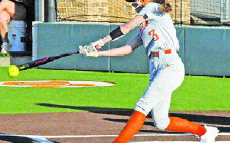 AVERY SMITH HITS the ball during the Caldwell-Lexington game last Thursday afternoon. -- Tribune photo by Denise Squier
