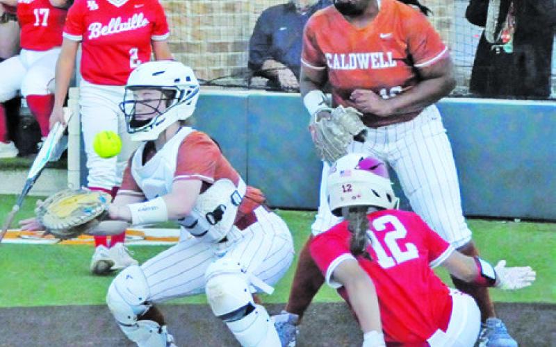 THE BALL APPROACHES THE plate during the Caldwell’s district opener against Bellville last Tuesday night. Tribune photo by Denise Squier