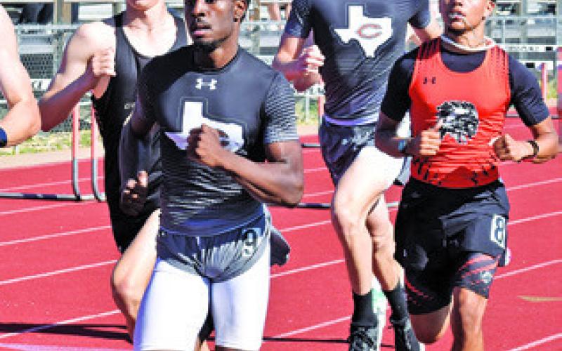 CALDWELL’S DEJUAN MATHIS and Tyler Muzny and Somerville’s X’Zavion Vela run in the boys 800-meter run at last Thursday’s Happy Skrabanek Relays in Caldwell. Tribune photo by Roy Sanders