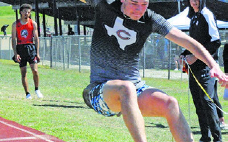 TYLER BOYD JUMPS in the boys long jump event during the Happy Skrabanek Relays. Tribune photo by Denise Squier