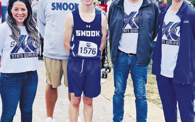 SNOOK ISD STAFF AND ADMINISTRATION attended the UIL State Cross Country Meet last Friday to root on Snook runner Ethan Janac. Pictured with Janac is Snook ISD Superintendent Megan Pape, Snook Athletic Director Dylan Conway, Snook High School Principal Lee Hafley and Snook Cross Country Coach Meagan Mitchell.