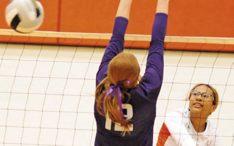 SOMERVILLE’S ALAZIA VELA gets a kill by getting the ball past Thrall’s Rae Johnson during the Lady Yeguas-Lady Tigers bi-district playoff match last week. -- Tribune photo by Denise Squier