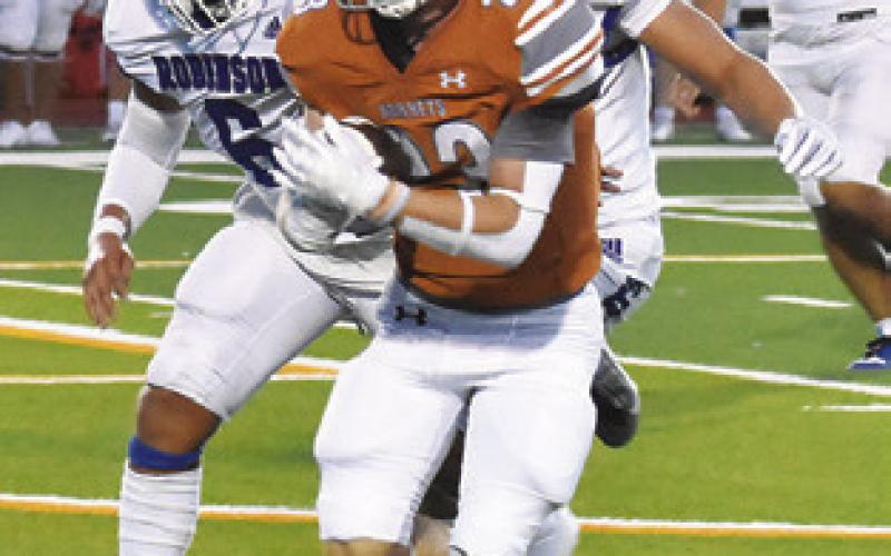 BRAXTON FRITCHER carries the ball for Caldwell in the Robinson game.