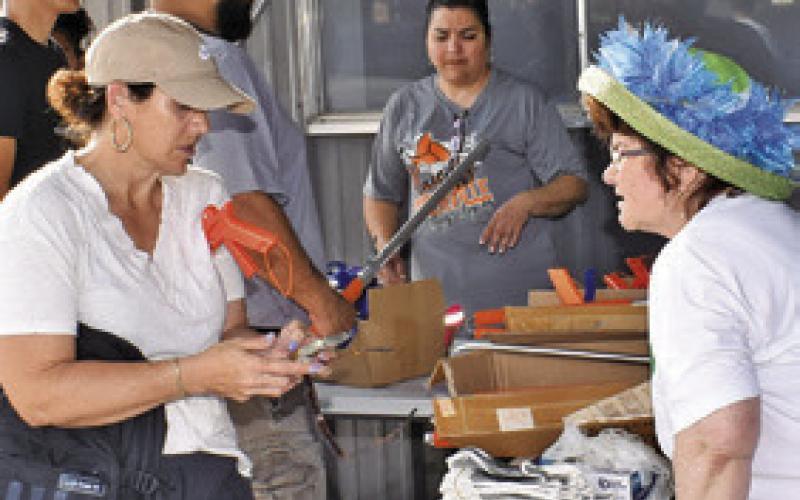 KATHY POLLOCK OF the City of Somerville, right, works on Saturday, April 26, at Spring Into Clean. Many local residents participated.
