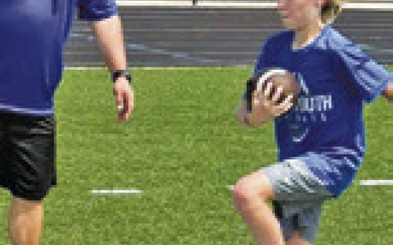 ATHLETES ATTENDING the Little Jays Football Camp worked on basic skills and drills.