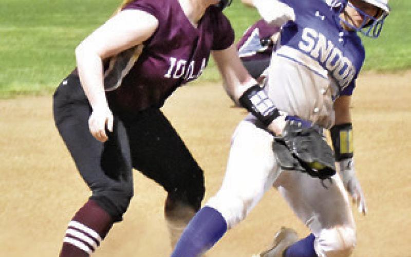 MARISSA BATISTE reaches third base during the Snook-Iola game earlier this month.
