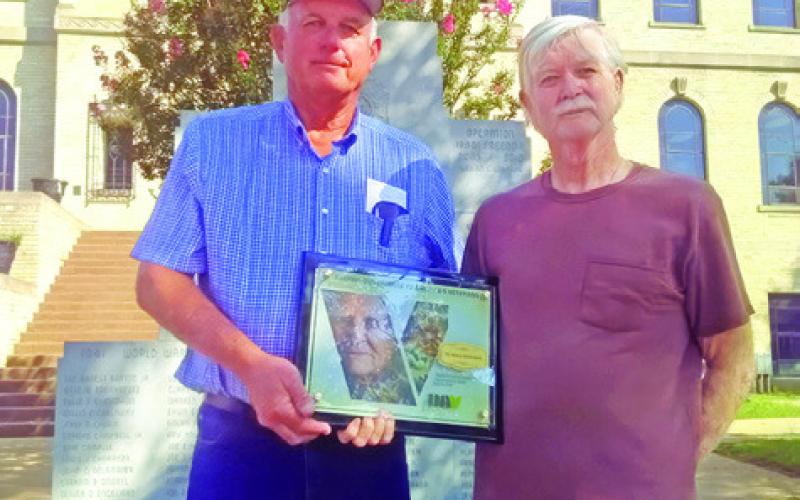 COMMANDER CHARLES REED of Disabled American Veterans Chapter 200 Bryan presents this plaque to Franklin Karasek, Service Officer of Burleson County Chapter 86, for Chapter 86’s 75 years of service assisting veterans and their families. Photo courtesy of Franklin Karasek