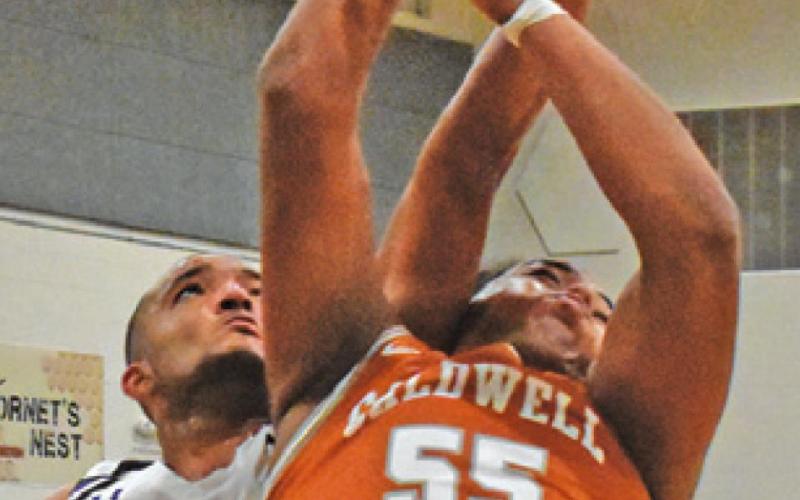 DELVIN MORRIS of Caldwell fights for the ball in the Hornets’ 72-49 victory.