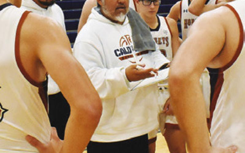 RENE CANTU, Caldwell’s new head coach, talks to players during a timeout against Somerville. Tribune photo by Roy Sanders