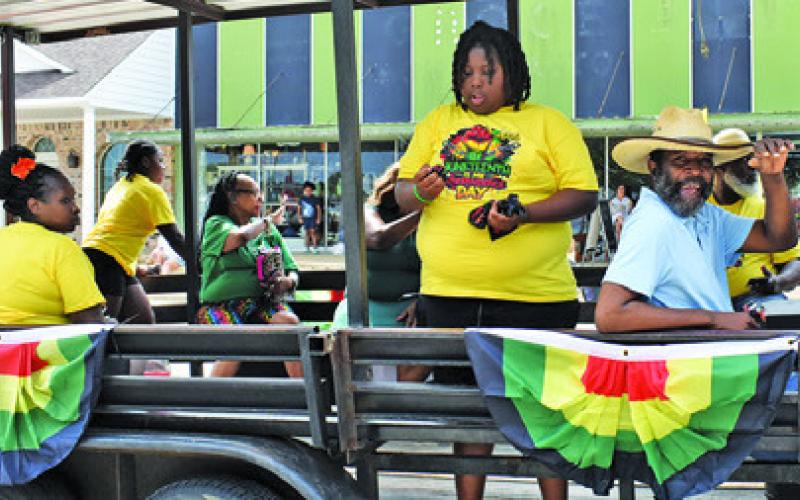 THE DOUBLE STANDARDS Party Bus was among the floats featured on Saturday at the annual Juneteenth Parade in downtown Caldwell. Tribune photo by Roy Sanders