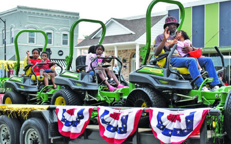 TUNIS LAWN AND Lots LLC was one of the featured floats on Saturday at the annual Juneteenth Parade in downtown Caldwell. Tribune photo by Roy Sanders