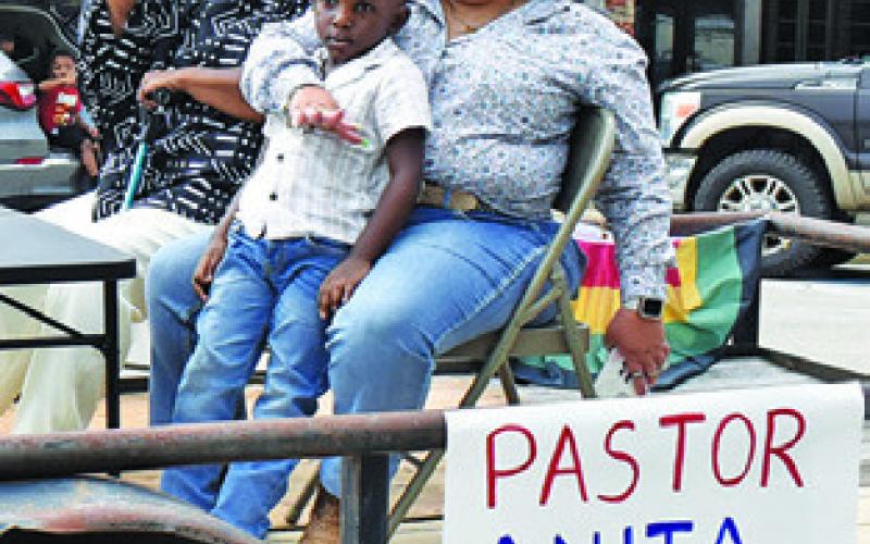 PASTOR ANITA Williams of Shiloh Missionary Baptist Church is joined by Brittany Richmond and Royal Richmond at the parade.