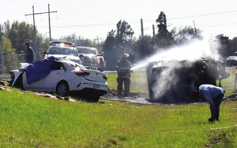 FIREFIGHTERS RESPOND TO the scene of this fatal accident on State Highway 21 West.