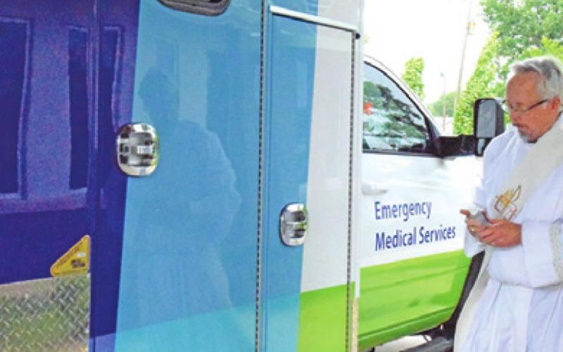 DEACON JOHN PELLETIER blessed this new ambulance for Burleson County during a ceremony on Monday afternoon in Somerville.