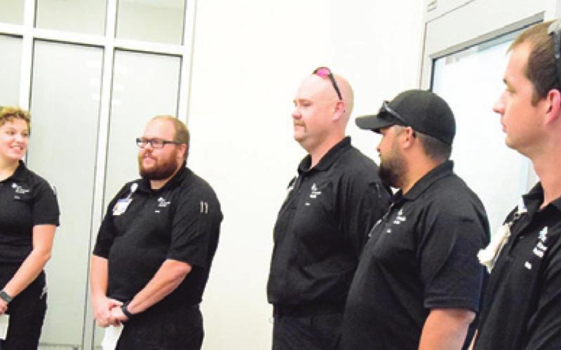 CHI EMS STAFF introduced themselves during a ceremony on Monday to bless the new ambulance which will be stationed in Somerville.